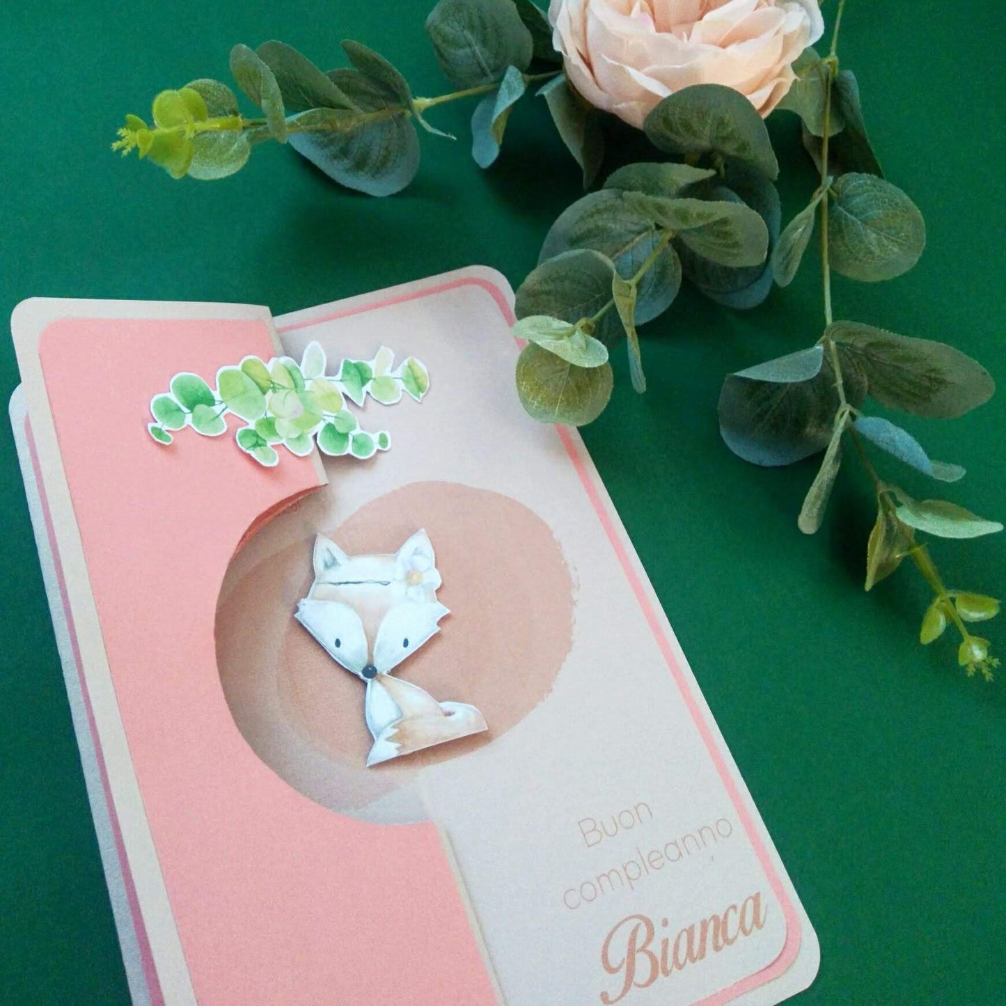 Biglietto di auguri con figura rotante